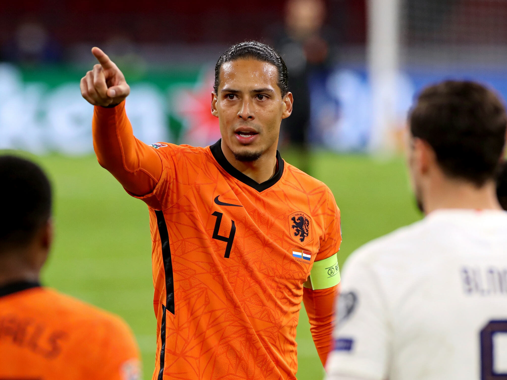 Netherlands defender Virgil van Dijk organizing defense at Euro 2024, boosting demand for his Liverpool jersey.