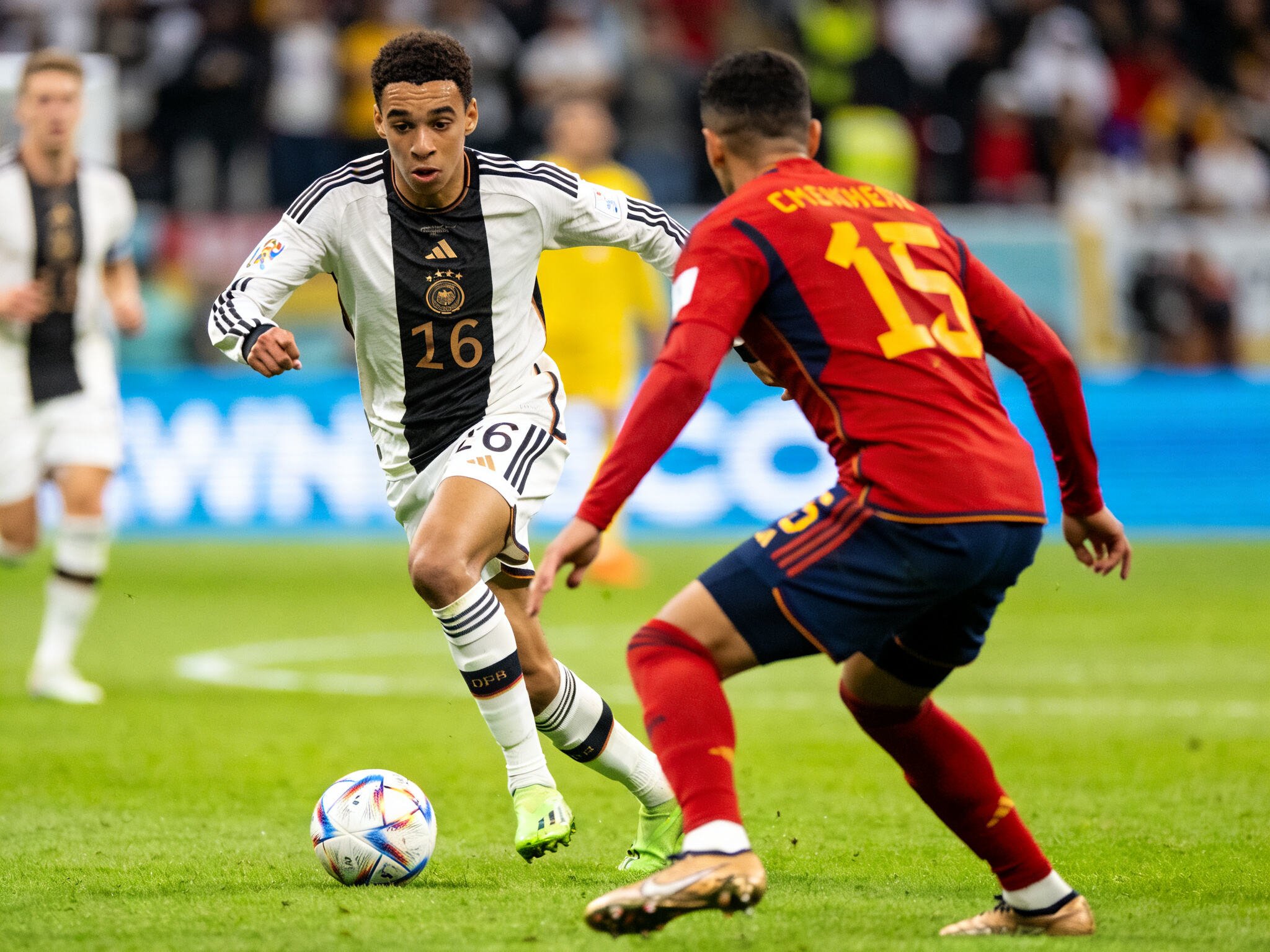 Germany young star Jamal Musiala dribbling at Euro 2024, driving sales for his Bayern Munich fan jersey.