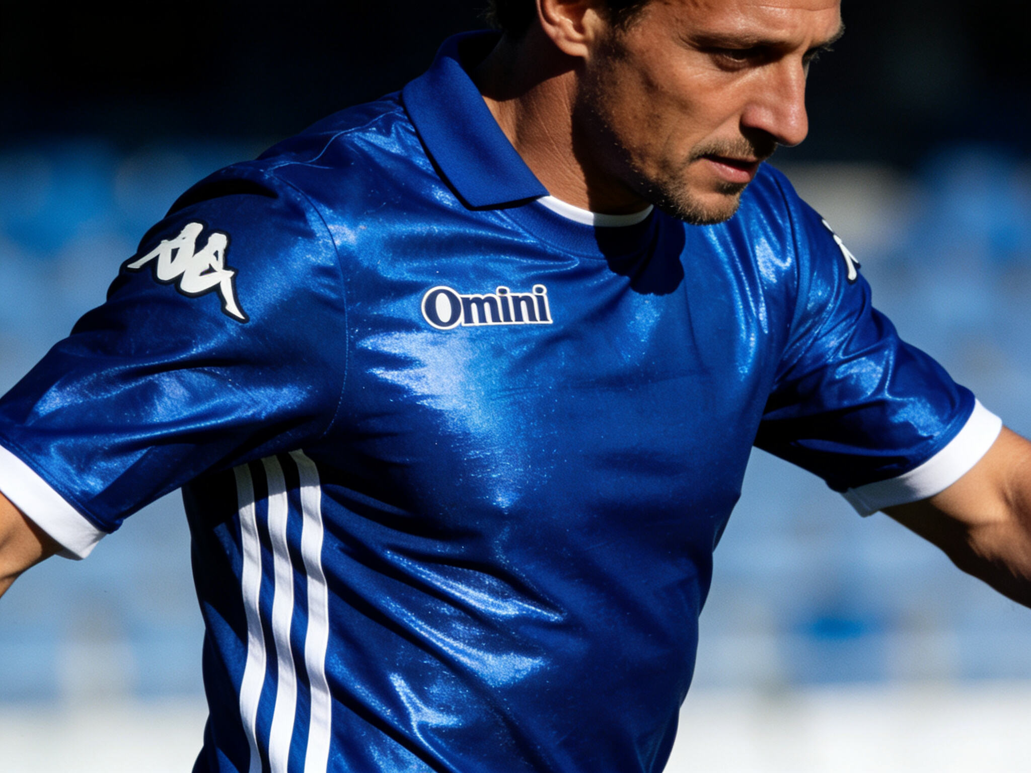 Francesco Totti of Italy in action during UEFA Euro 2000, wearing the form-fitting, shiny royal blue Kappa jersey, demonstrating the sleek and elegant design that defined the tournament's style.