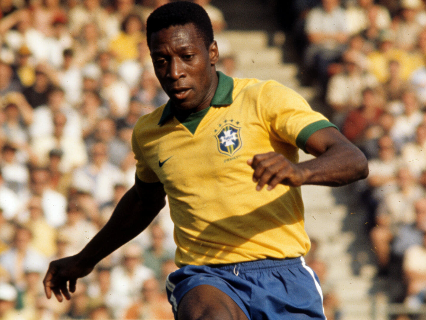 High-quality shot of the 1970 Brazil jersey, possibly worn by Pel&eacute; in a classic action photo.