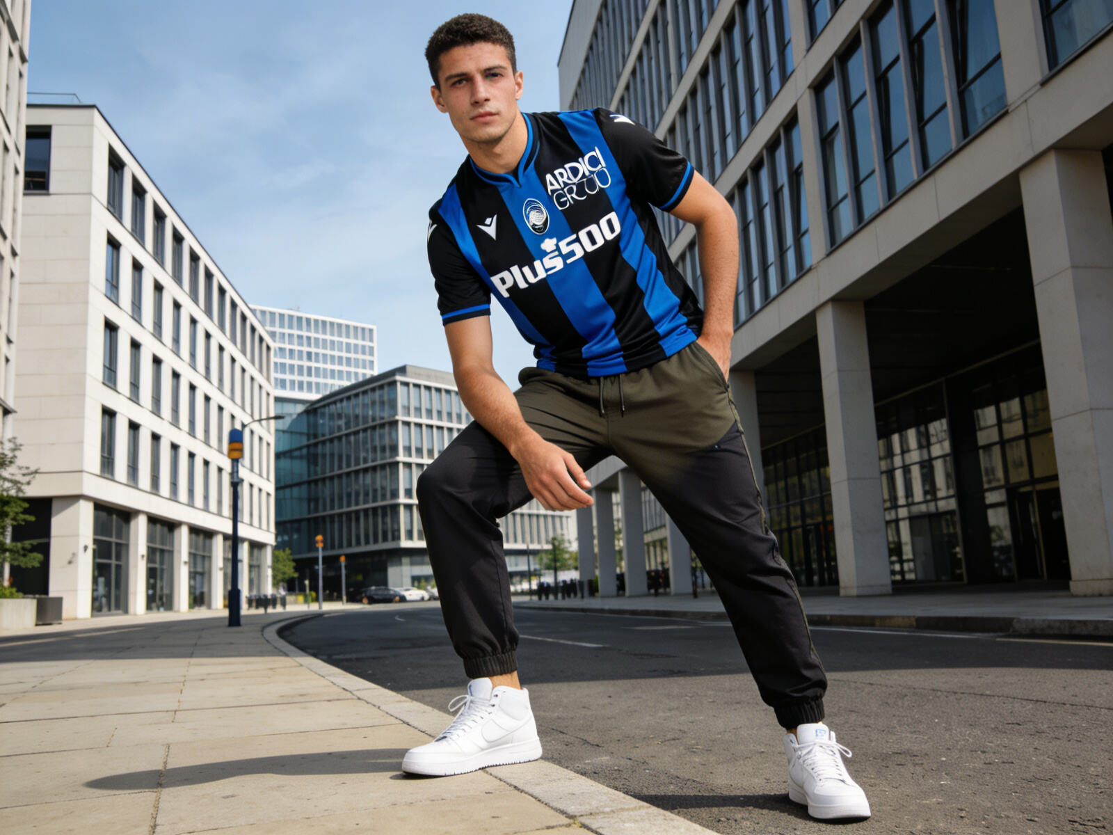 Man styling Atalanta Bergamo black and blue Serie A jersey with casual pants and sneakers for urban streetwear look